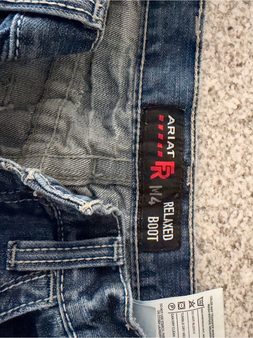 Ariat Men's Relaxed Boot Jeans in Medium Blue Denim with Red Logo